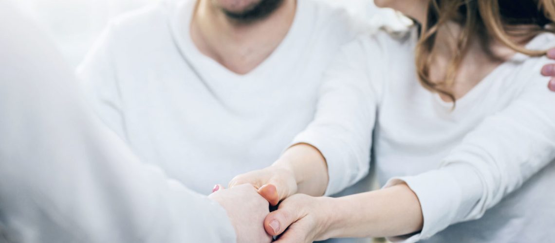 Close up of hands being shacked